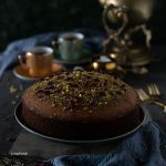 Semolina, rose and pistachio cake covered in pistachios and dried rose petals