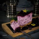 bite of blueberry cheesecake on a spoon, purple cake photography
